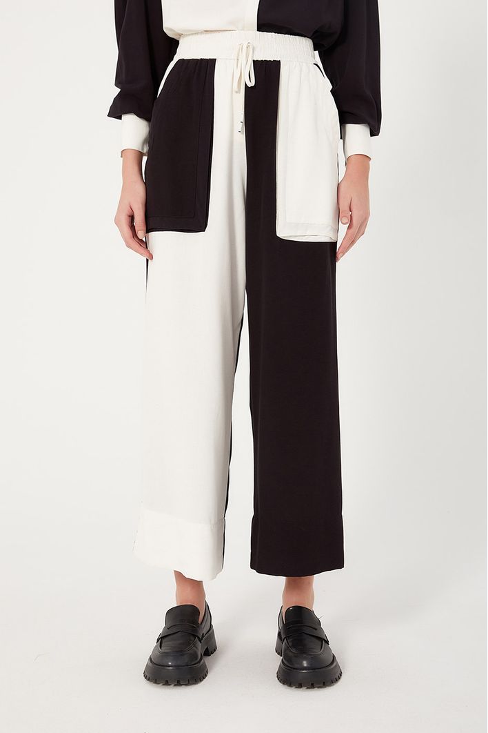 Calça Bicolor Bolsos