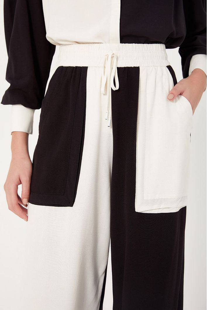 Calça Bicolor Bolsos