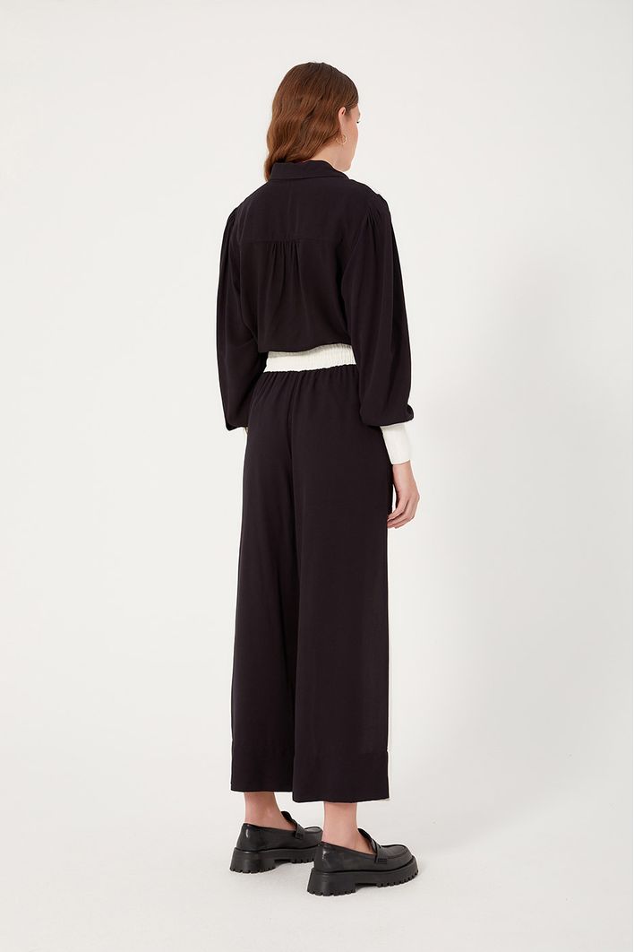 Calça Bicolor Bolsos